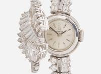 A Ladies Hidden Dial Platinum and Diamond Omega Watch