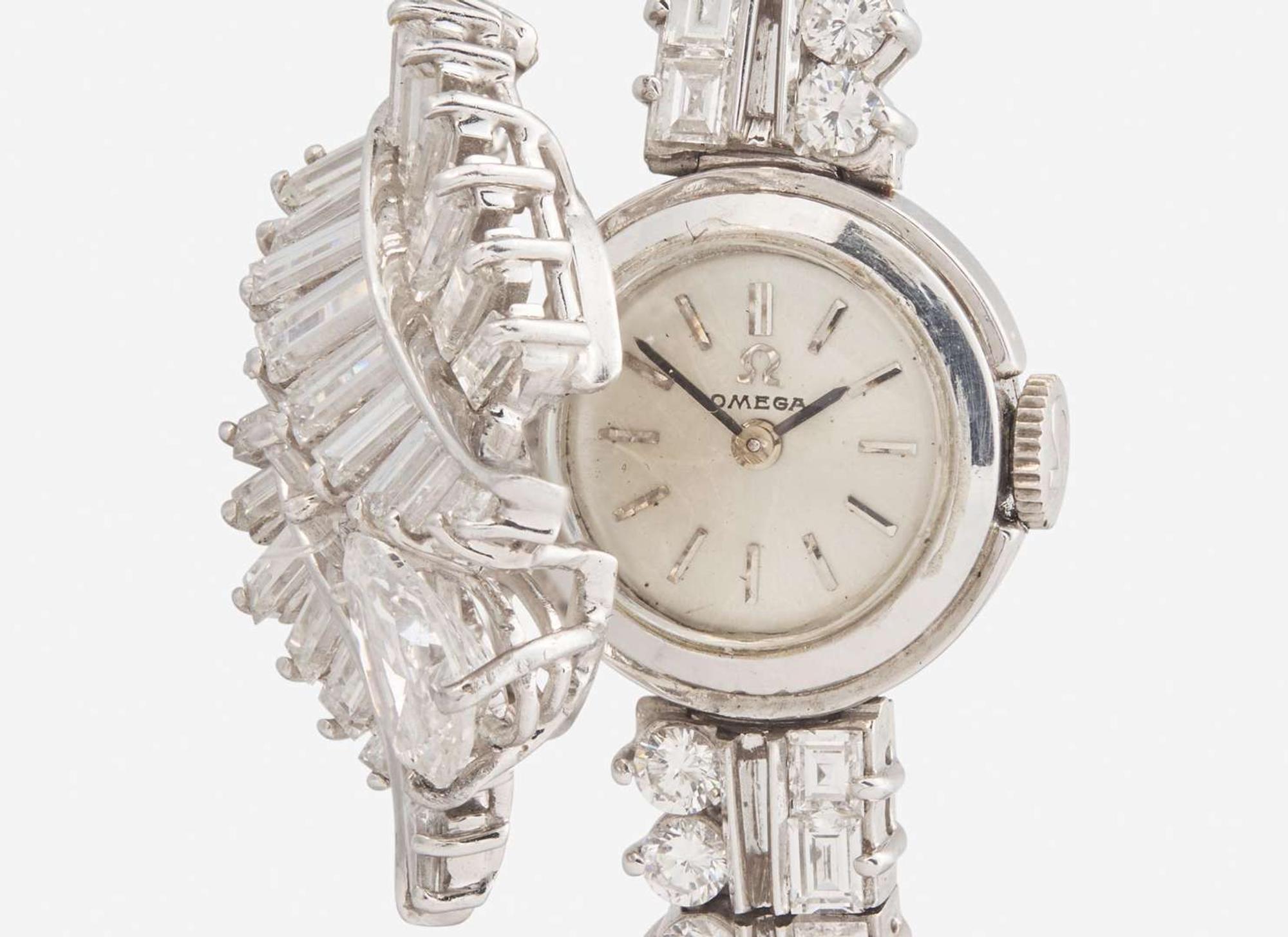 A Ladies Hidden Dial Platinum and Diamond Omega Watch