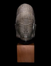 A Khmer Stone Head of Deity