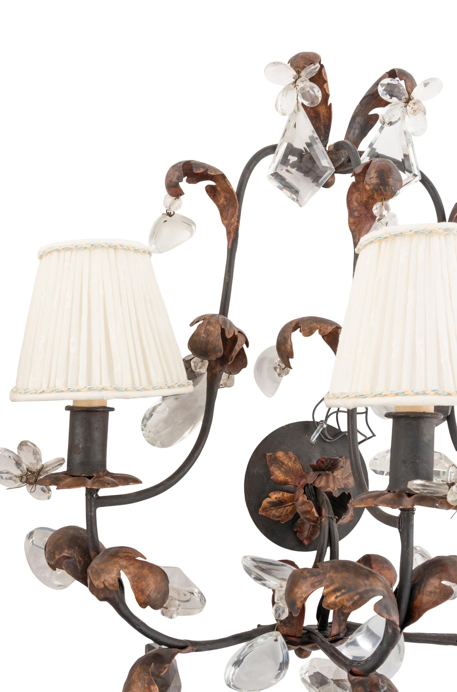 A Pair of French Parcel Gilt Iron and Cut Glass Three-Light Sconces