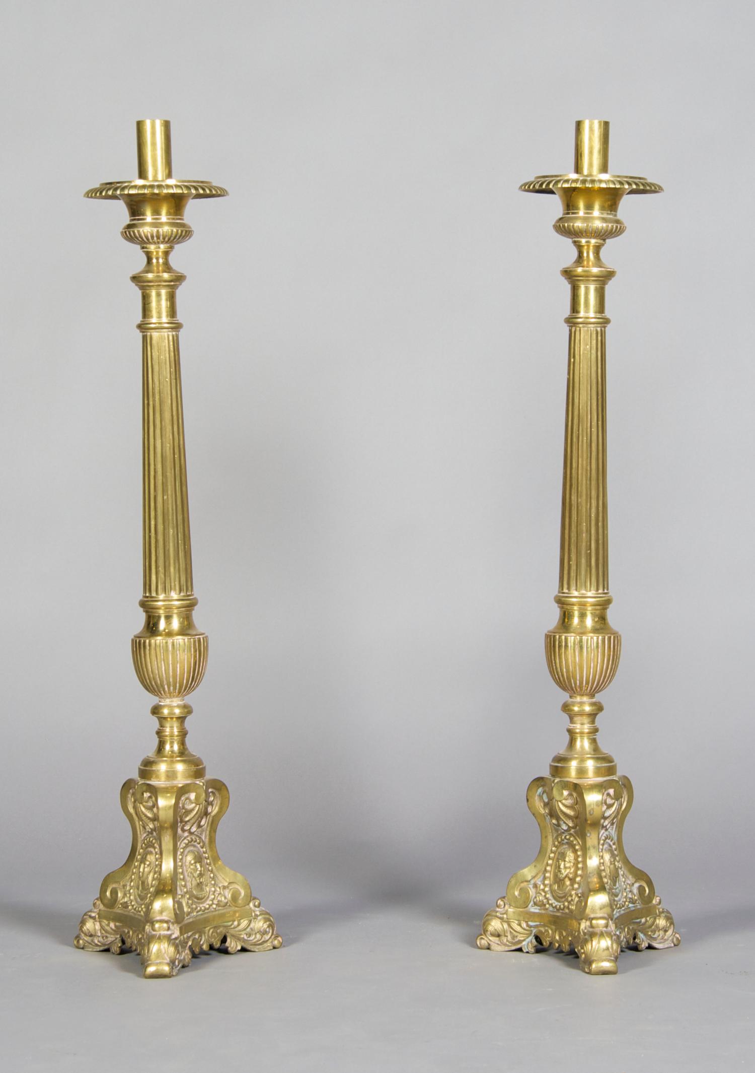 A Pair of Brass Pricket Sticks, Height 33 1/4 inches.