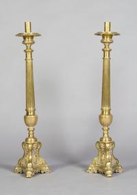 A Pair of Brass Pricket Sticks, Height 33 1/4 inches.