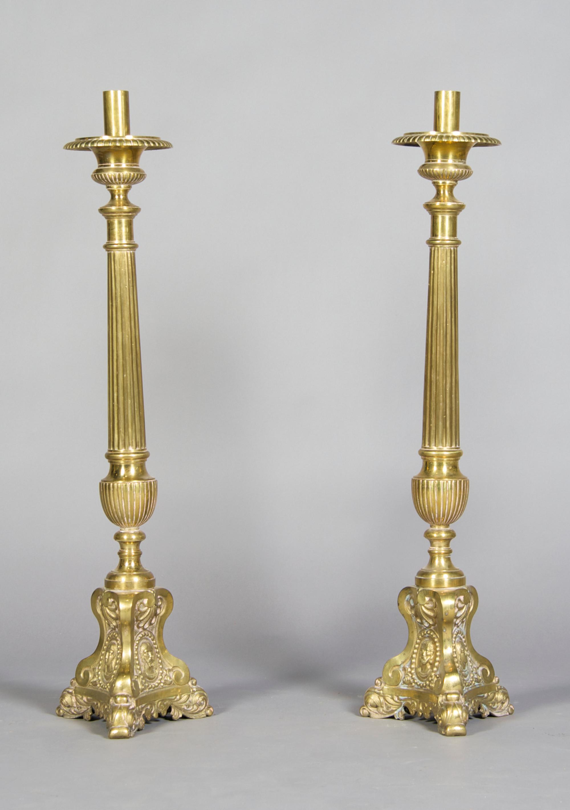 A Pair of Brass Pricket Sticks, Height 33 1/4 inches.