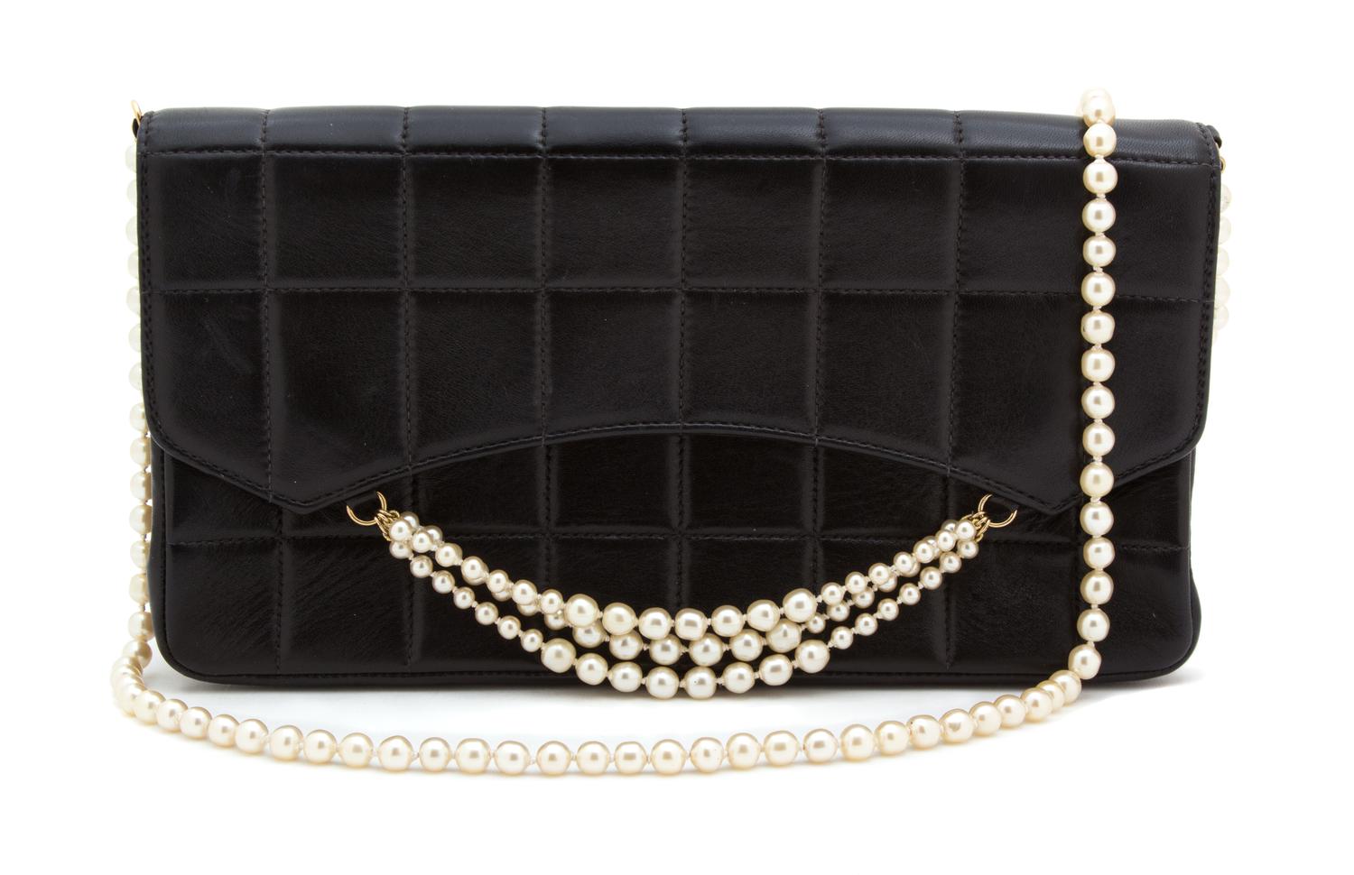 A Chanel Black Leather Quilted Flap Handbag, 10.25" x 5.75" x 2.5".