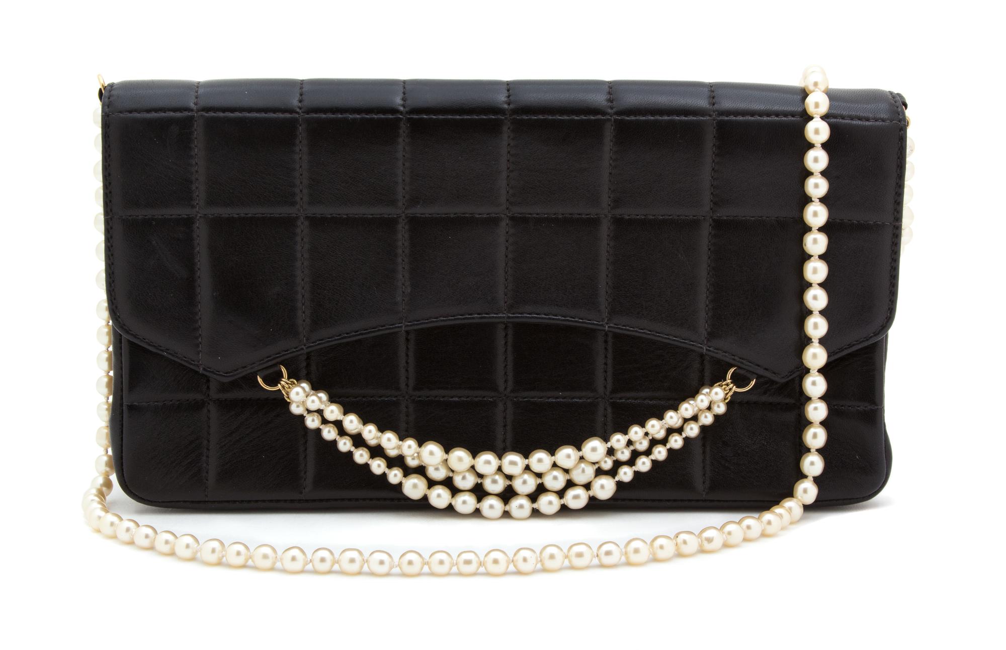 A Chanel Black Leather Quilted Flap Handbag, 10.25" x 5.75" x 2.5".