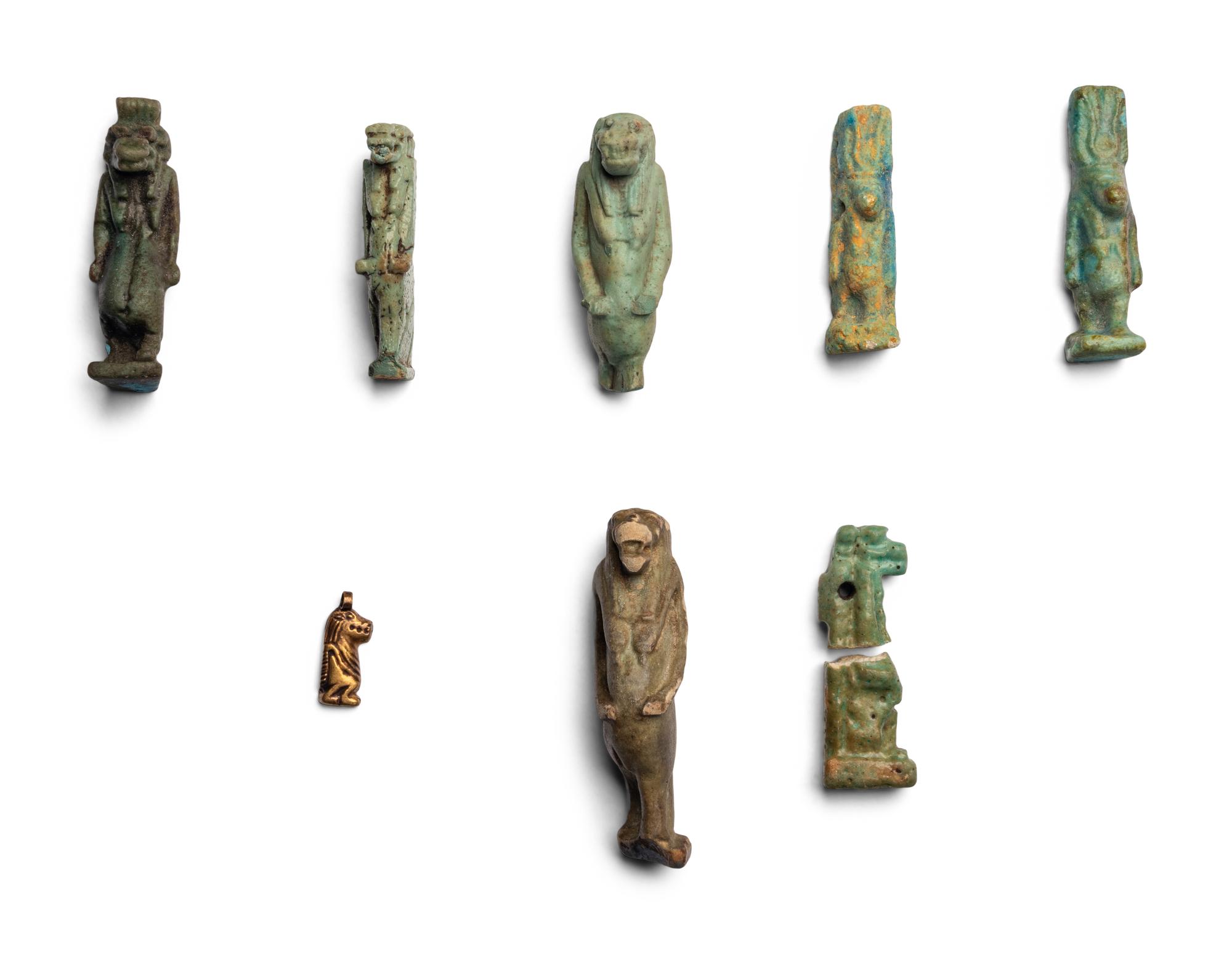 Eight Egyptian Faience and Gold Taweret Amulets