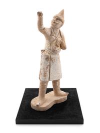 A Pottery Figure of a Groom