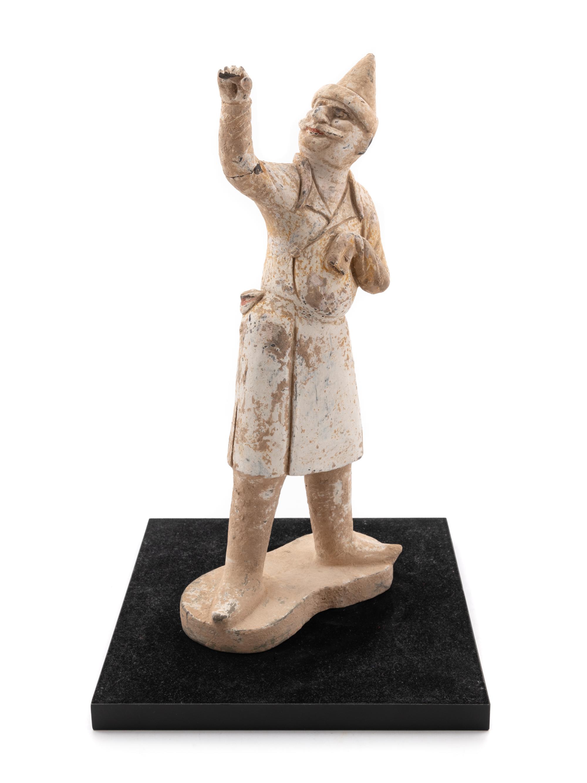 A Pottery Figure of a Groom