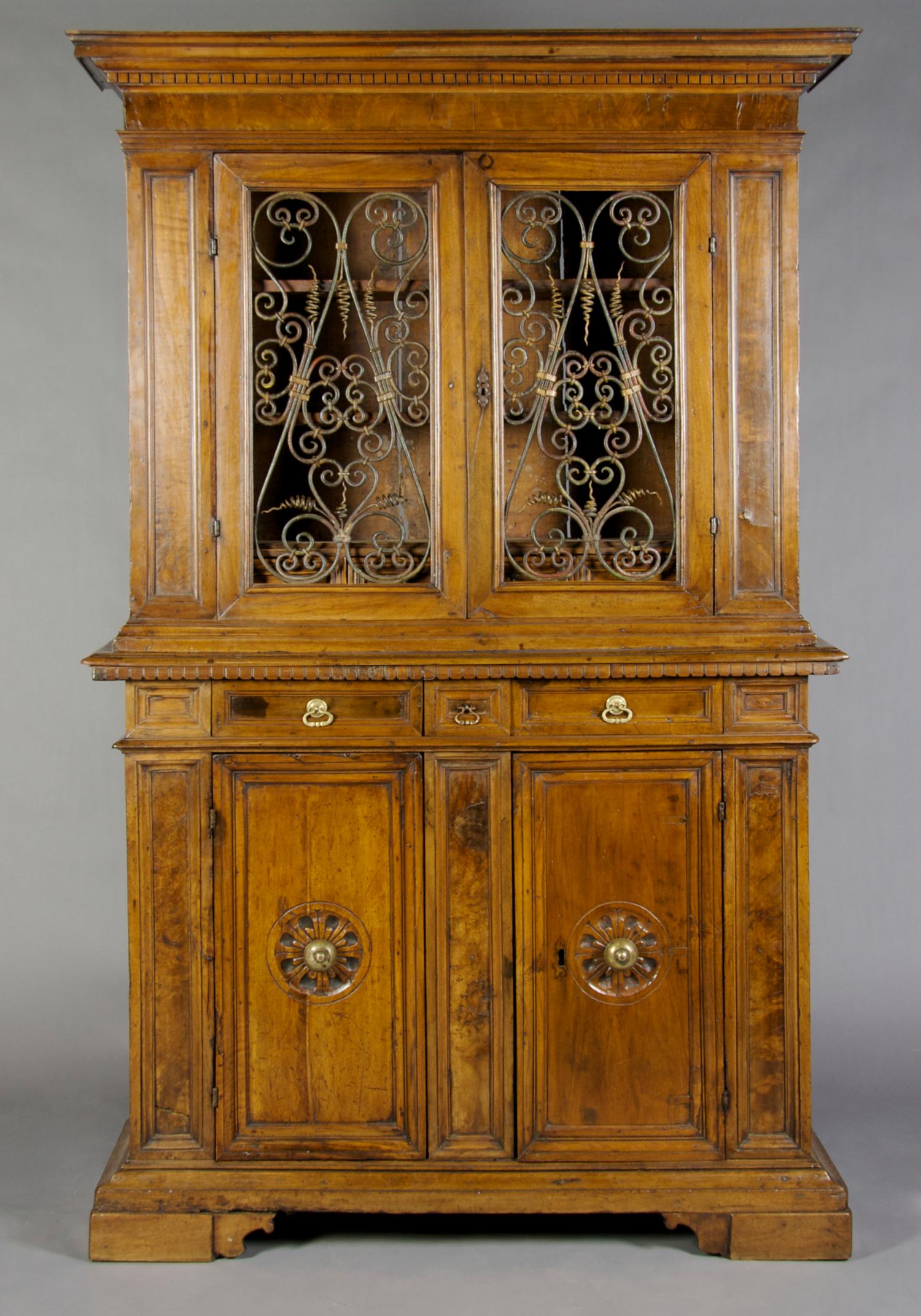 A Continental Walnut Buffet a Deux Corps, Height 71 x width 49 x depth 15 1/2 inches.