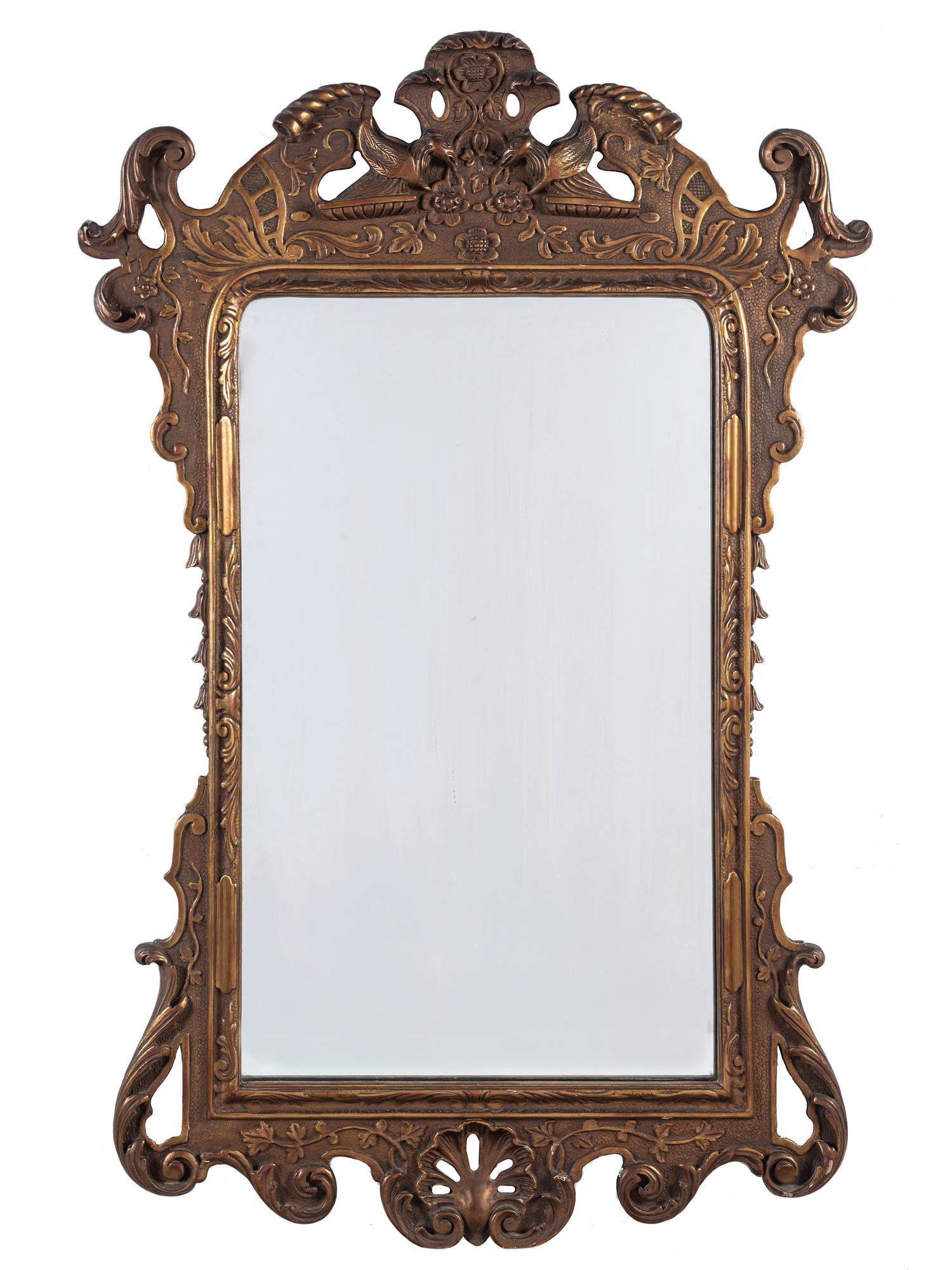 A Chinoiserie Style Gilt and Molded Mirror