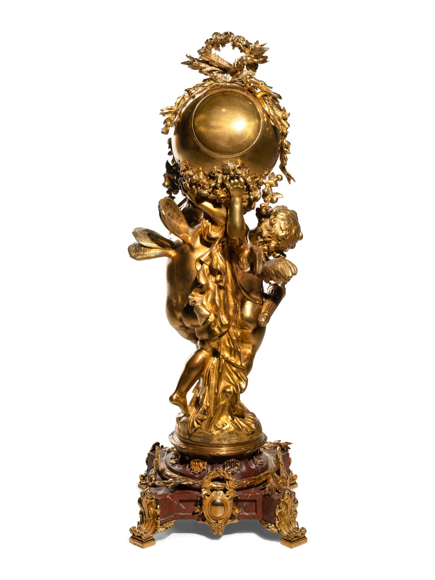 A French Gilt Bronze and Marble Figural Clock