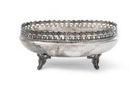 A Continental Silver Cake Basket, , of oval form with a pierced floral decorated rim and raised on foliate feet.