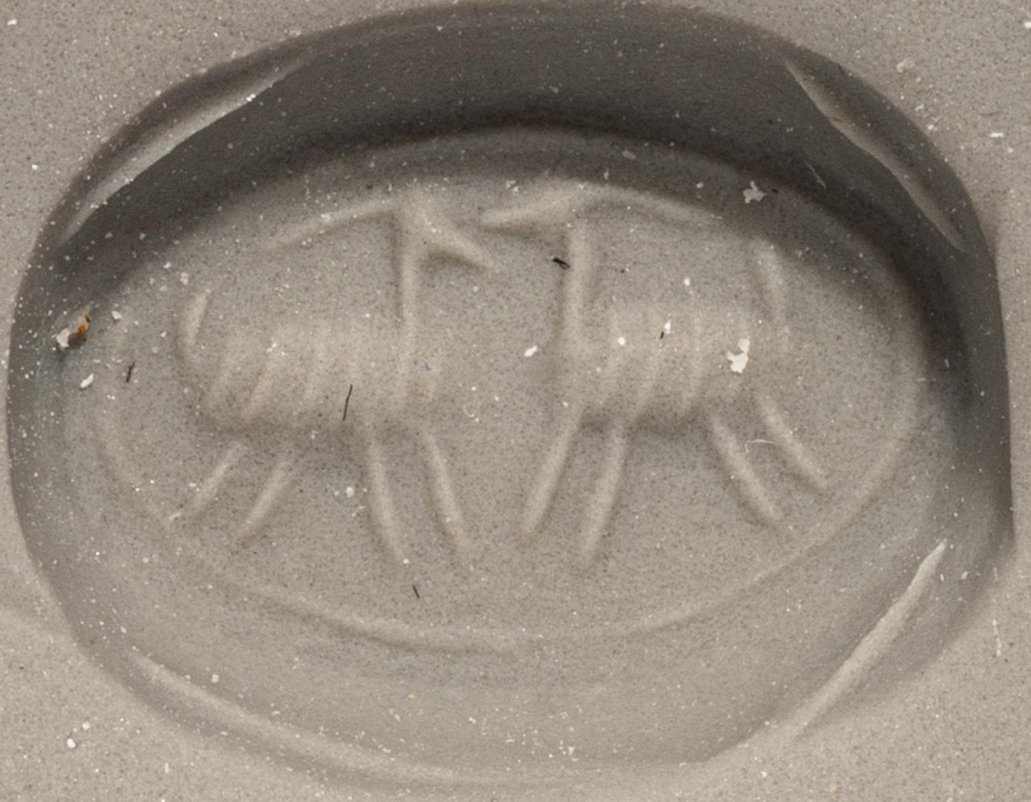 A Phoenician Hematite Scarab with Two Ibexes