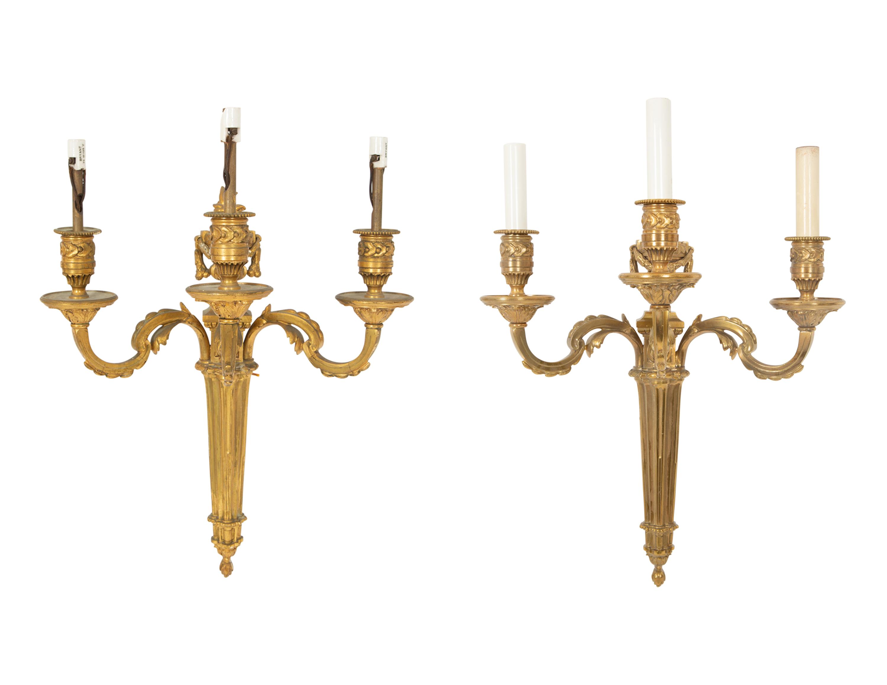 A Pair of Louis XVI Style Gilt Bronze Three-Light Wall Sconces
