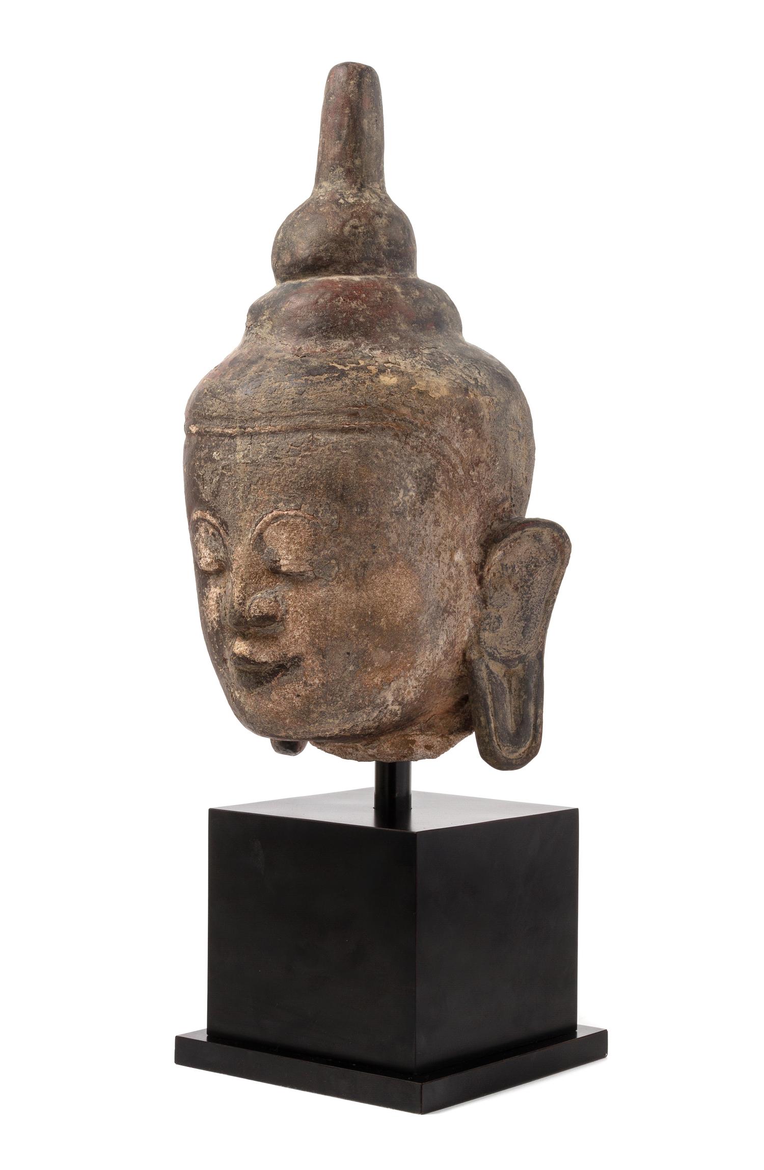 A Thai Stone Head of Buddha Height overall 26 1/2 inches.