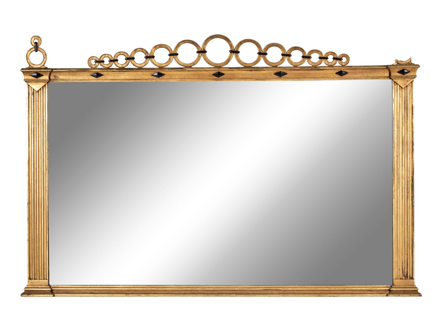 A Continental Giltwood and Parcel Ebonized Overmantel Mirror