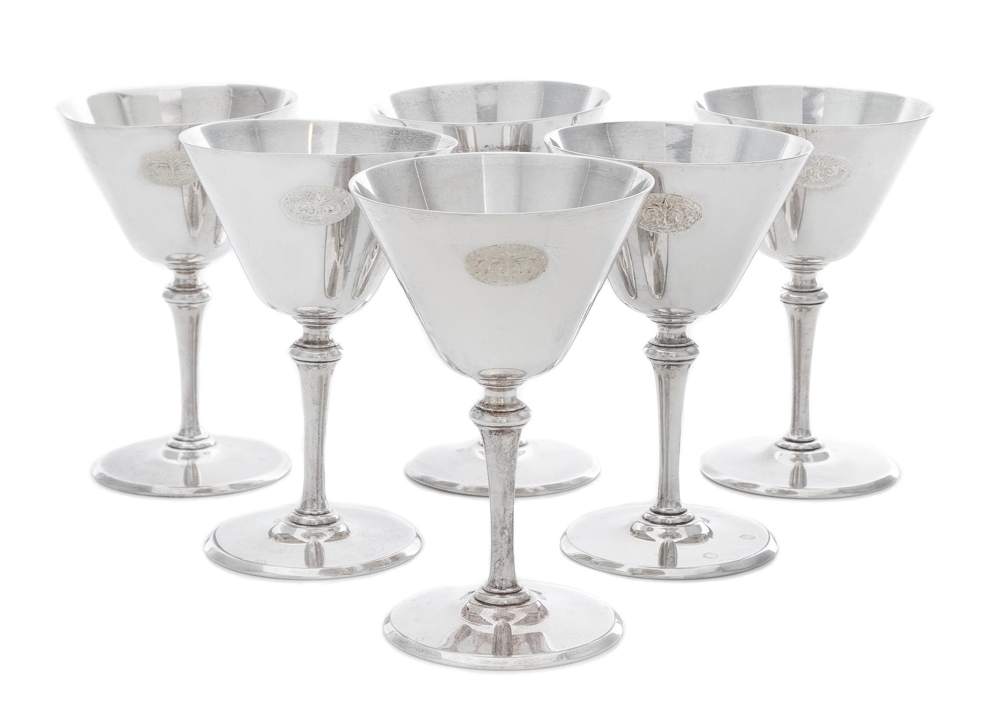 A Set of Six American Silver Cordial Stems, Tiffany & Co., New York, NY, Circa 1925, each having a conical cup with an engraved script