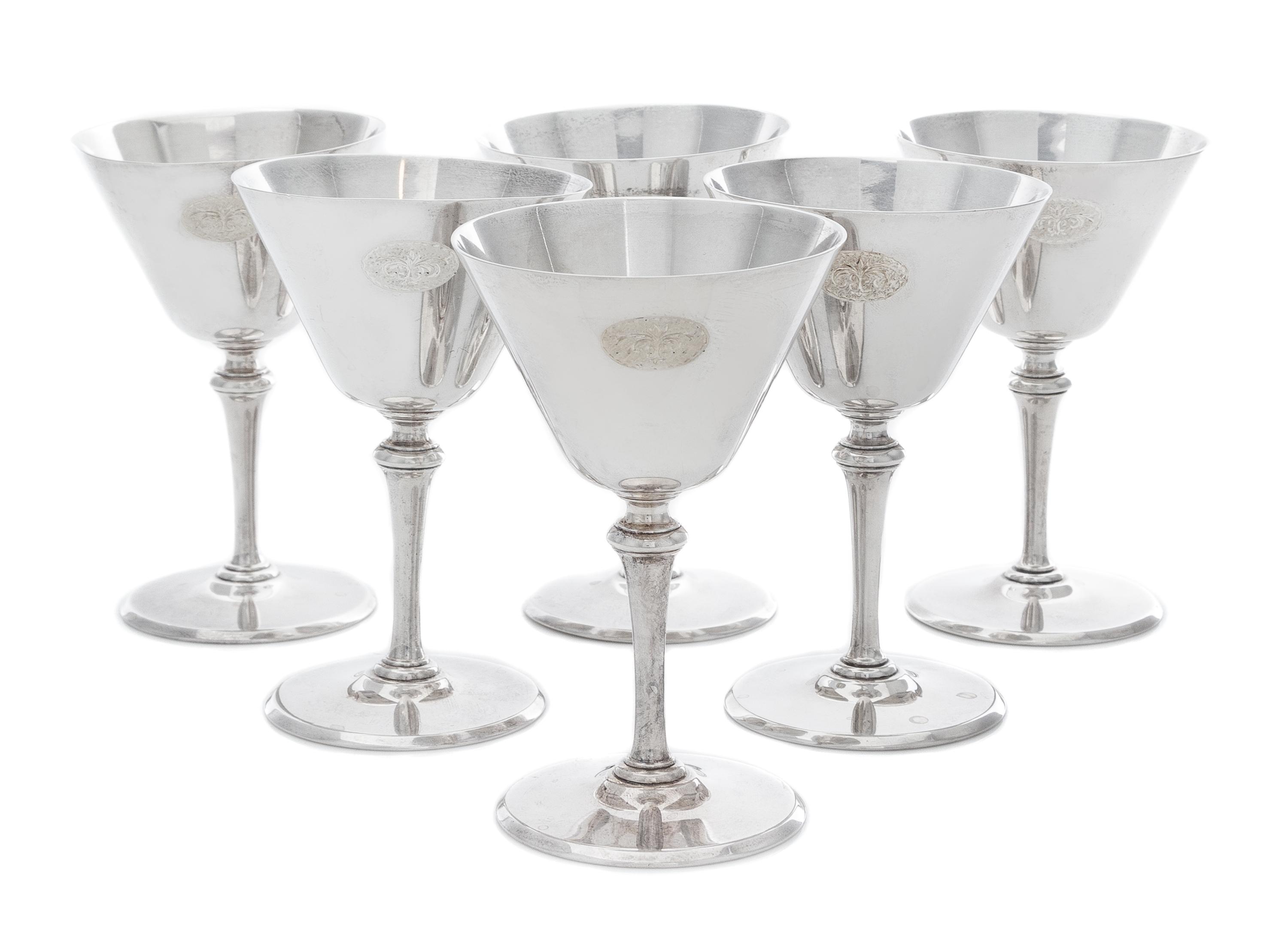 A Set of Six American Silver Cordial Stems, Tiffany & Co., New York, NY, Circa 1925, each having a conical cup with an engraved script