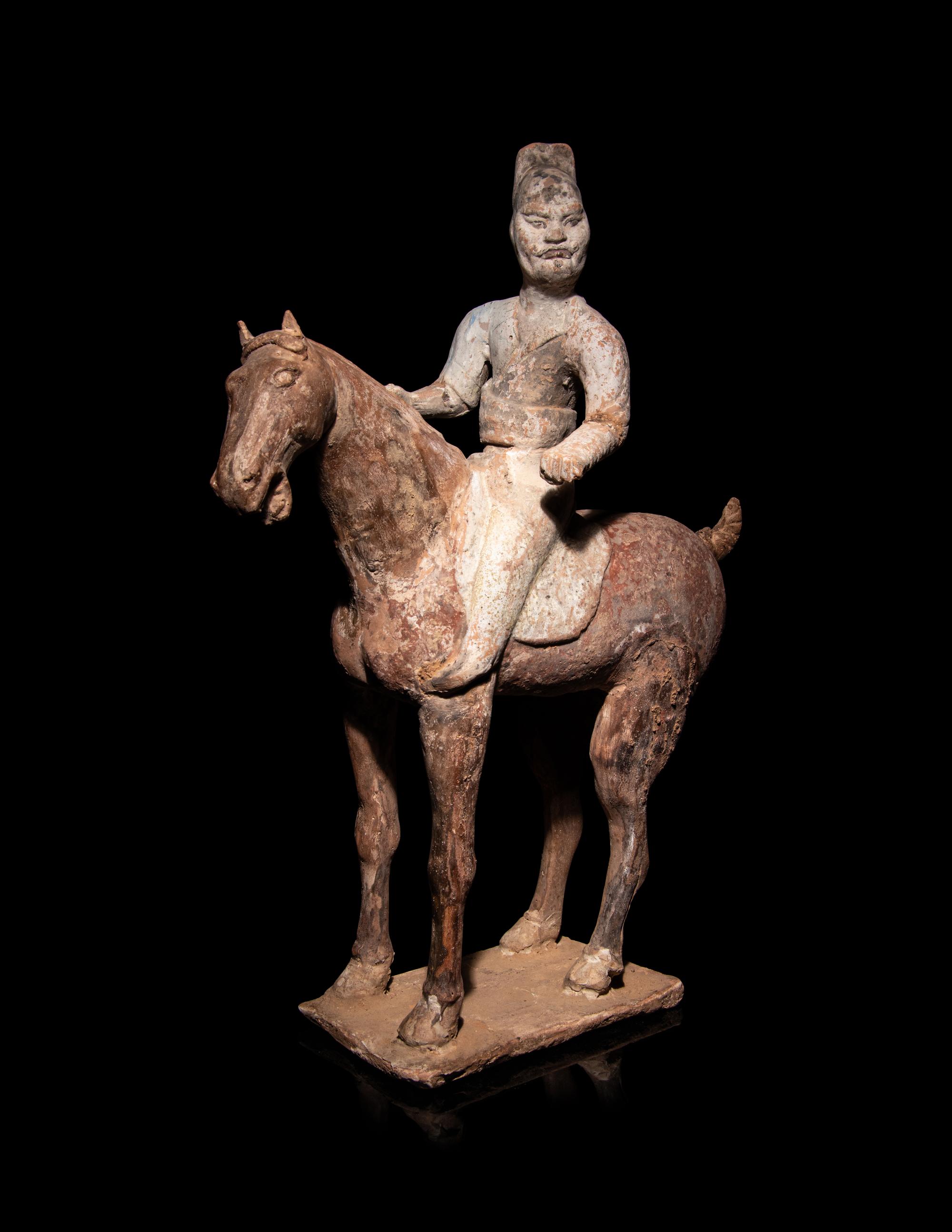 A Pair of Chinese Pottery Equestrian Figures