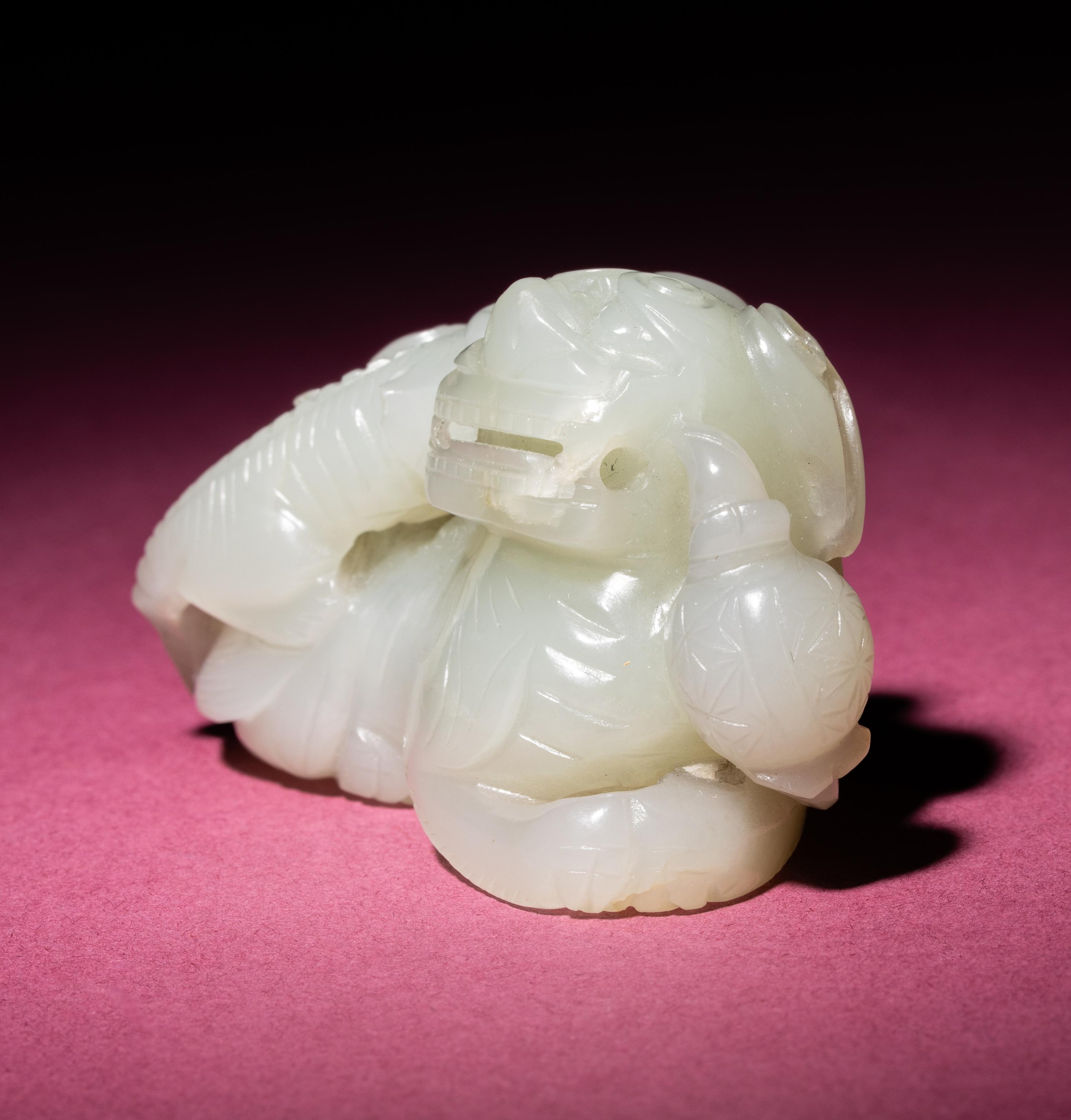 A Chinese Pale Celadon Jade Group of Fu Lions, Qing Dynasty — 清 青白玉太獅少獅把件