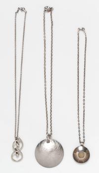 A Collection of Sterling Silver Circular Motif Pendant Necklaces, 34.60 dwts.