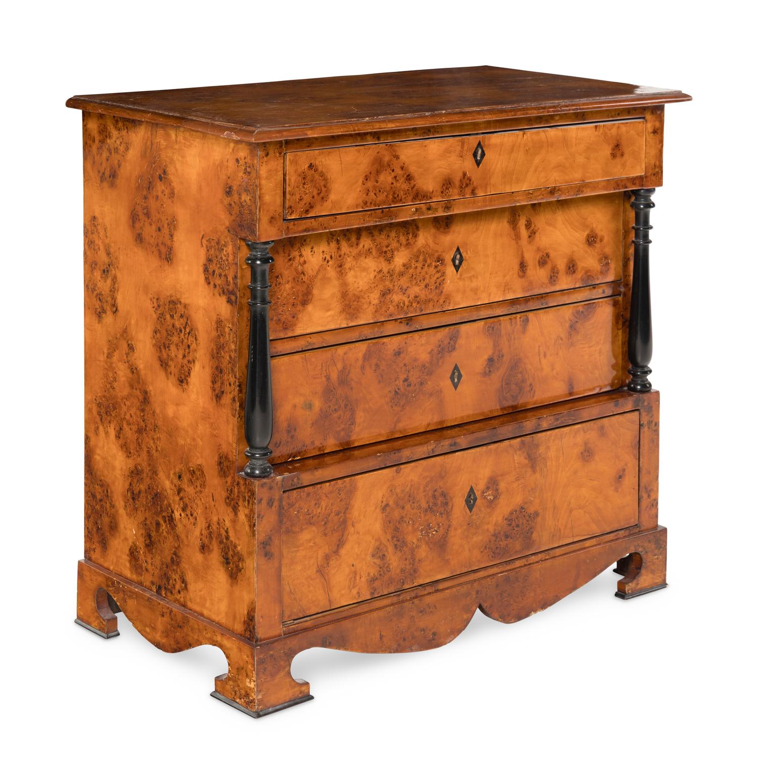 A Biedermeier Part-Ebonized Burlwood Commode