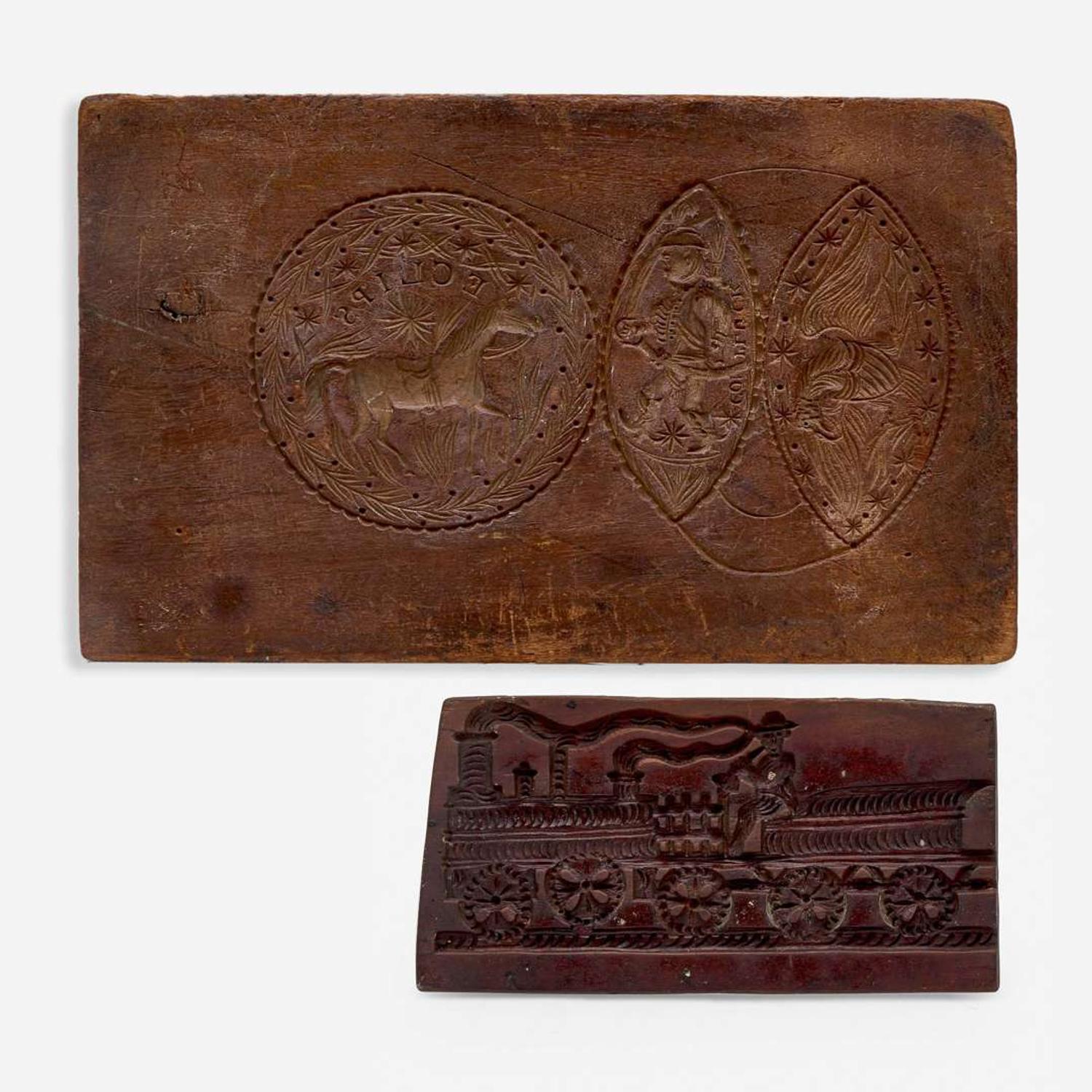 Two carved walnut cake boards 19th century