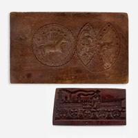 Two carved walnut cake boards 19th century