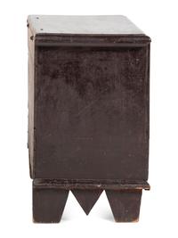 A Rare Pilgrim Century Black Painted Pine One-Drawer 'M' Chest
