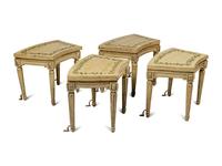 A Set of Four Louis XVI Cream and Polychrome Decorated Curved Window Benches