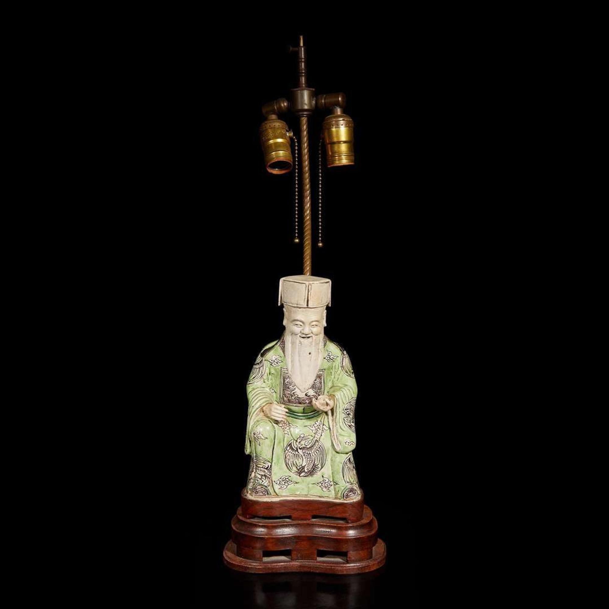 A Chinese famille verte-decorated figure of Cai Shen, mounted as lamp 素三彩財神改制檯燈 Kangxi period ???