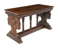A Florentine Renaissance Style Carved Walnut Trestle Table