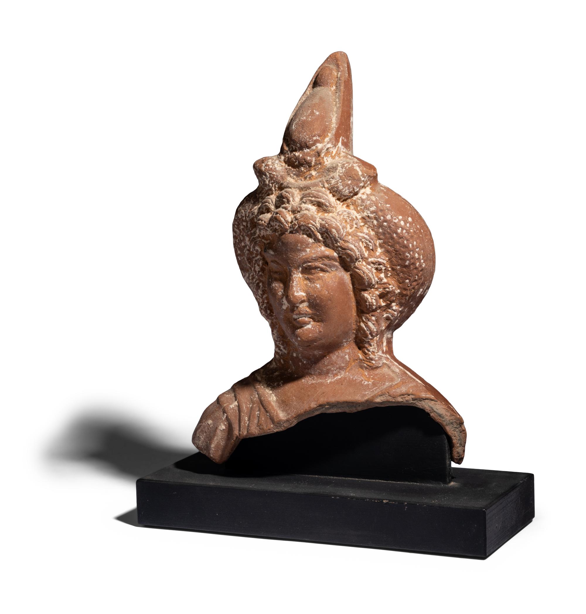 An Egyptian Terracotta Head of Harpocrates
