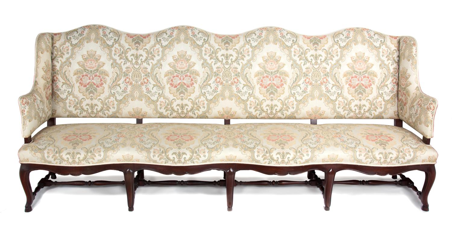 A Spanish Baroque Style Mahogany Sofa Height 43 1/2 x width 101 x depth 25 inches. — 20TH CENTURY