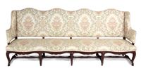 A Spanish Baroque Style Mahogany Sofa Height 43 1/2 x width 101 x depth 25 inches. — 20TH CENTURY