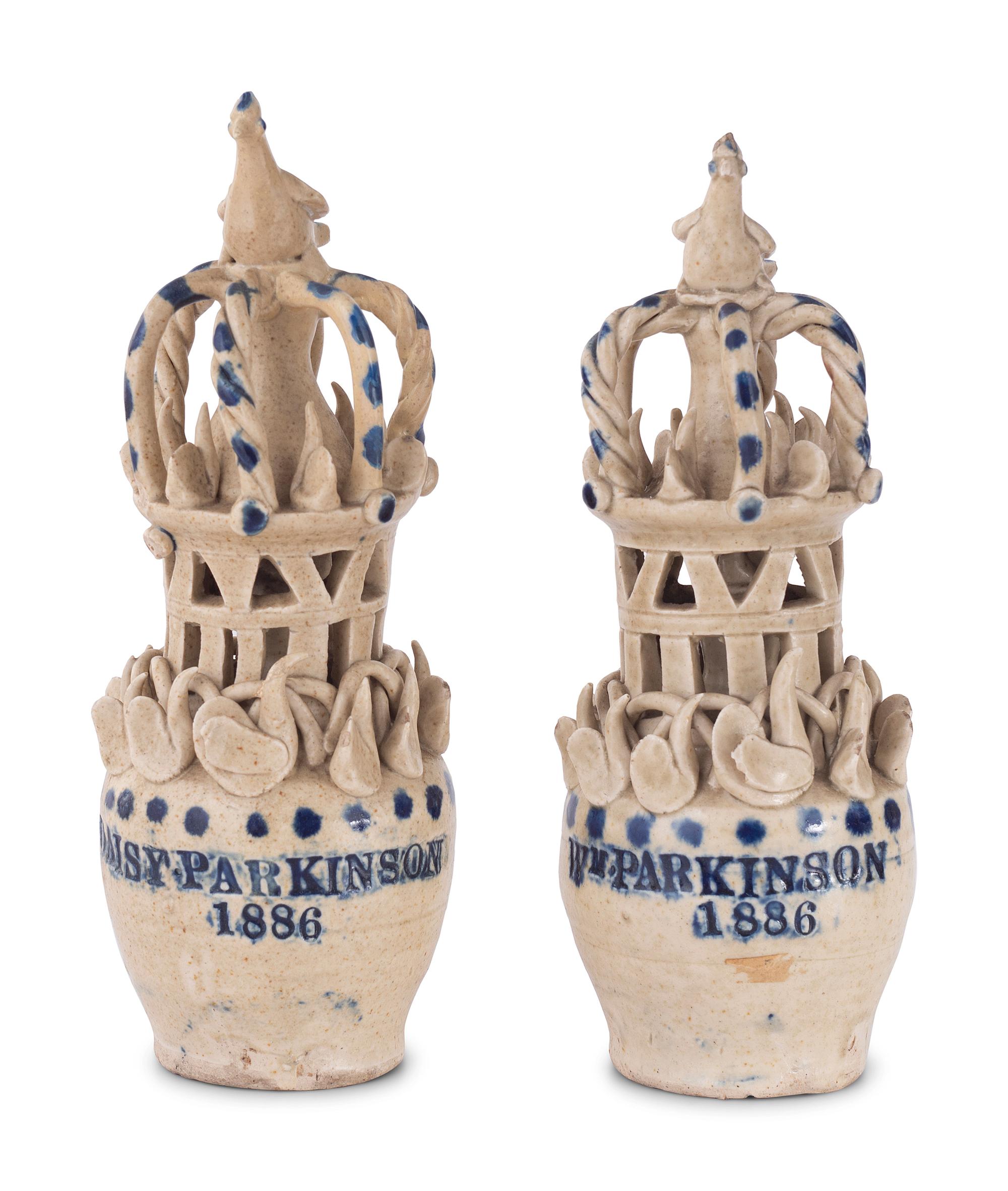 A Pair of Cobalt Decorated Stoneware Puzzle Banks