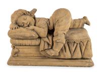 A Concrete Garden Sculpture of a Sleeping Girl