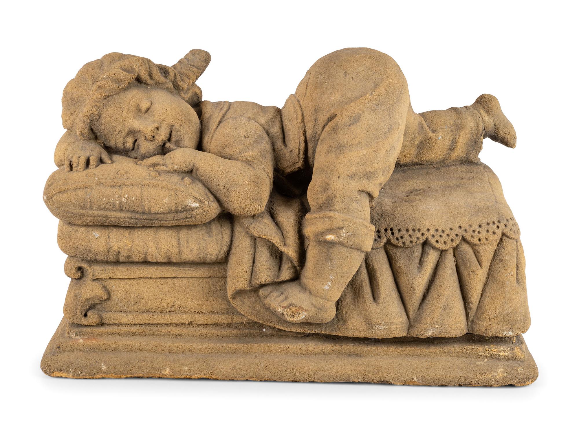 A Concrete Garden Sculpture of a Sleeping Girl