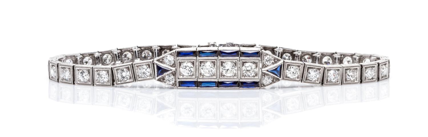 An Art Deco Platinum, Diamond and Synthetic Sapphire Bracelet, 11.50 dwts.