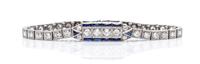An Art Deco Platinum, Diamond and Synthetic Sapphire Bracelet, 11.50 dwts.