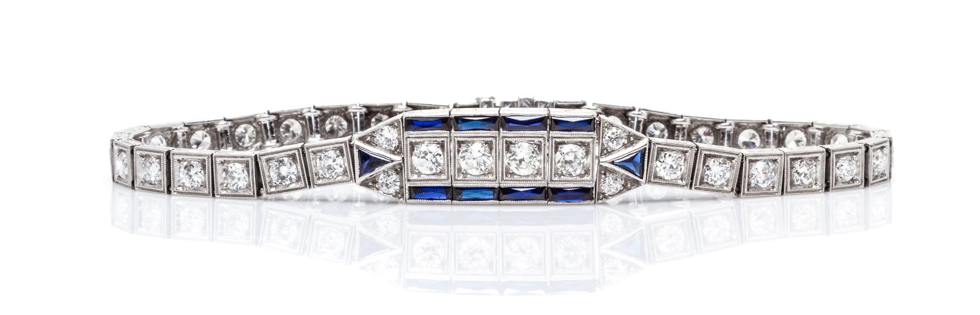 An Art Deco Platinum, Diamond and Synthetic Sapphire Bracelet, 11.50 dwts.