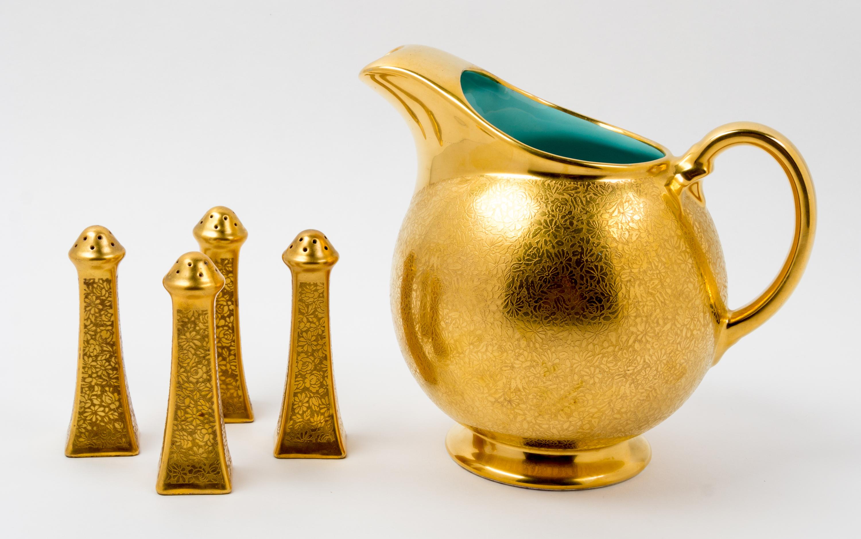 A Gilt Decorated Pitcher Height of pitcher 8 1/4 inches.
