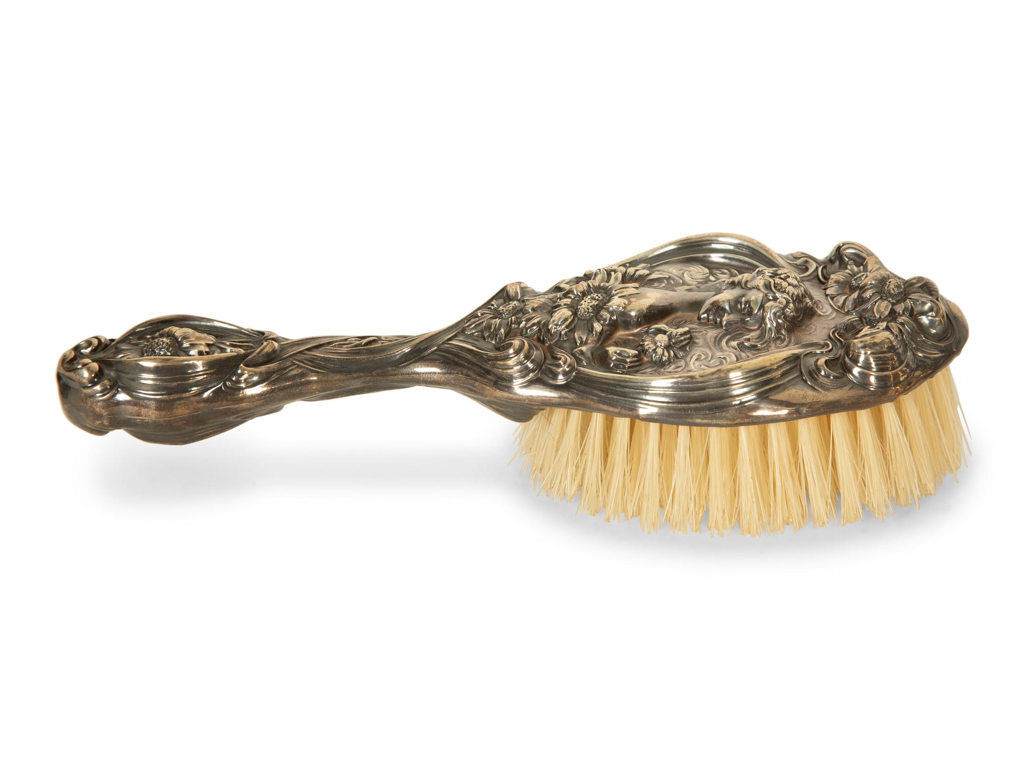 A Silver Hand Mirror and Hairbrush