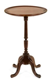 A Georgian Style Mahogany Tripod Table Height 25 1/4 x diameter 15 inches.