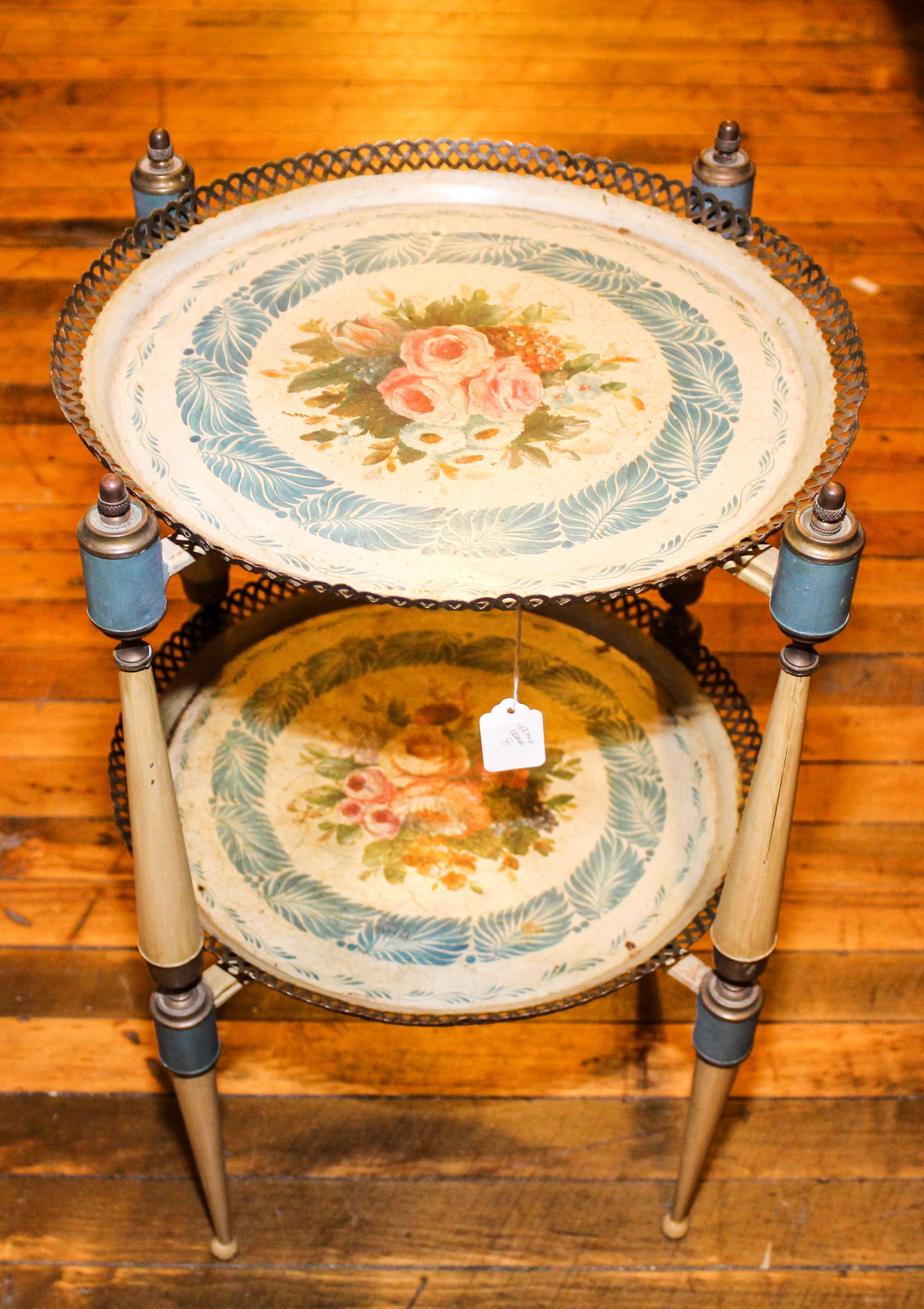 A Painted Tole Two-Tier Table. Height 23 inches.