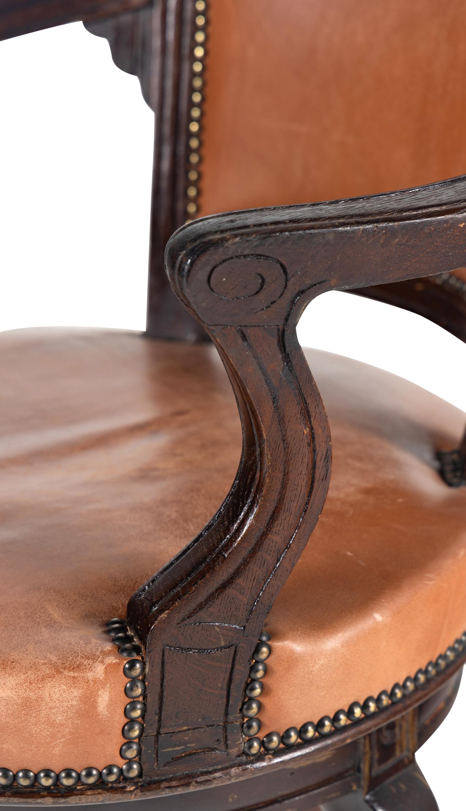 A Directoire Style Leather-Upholstered Swiveling Armchair