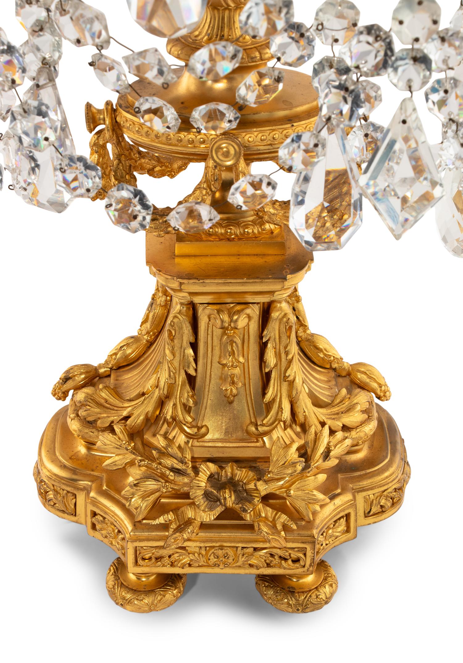 A Pair of French Gilt Bronze and Cut Glass Seven-Light Candelabra