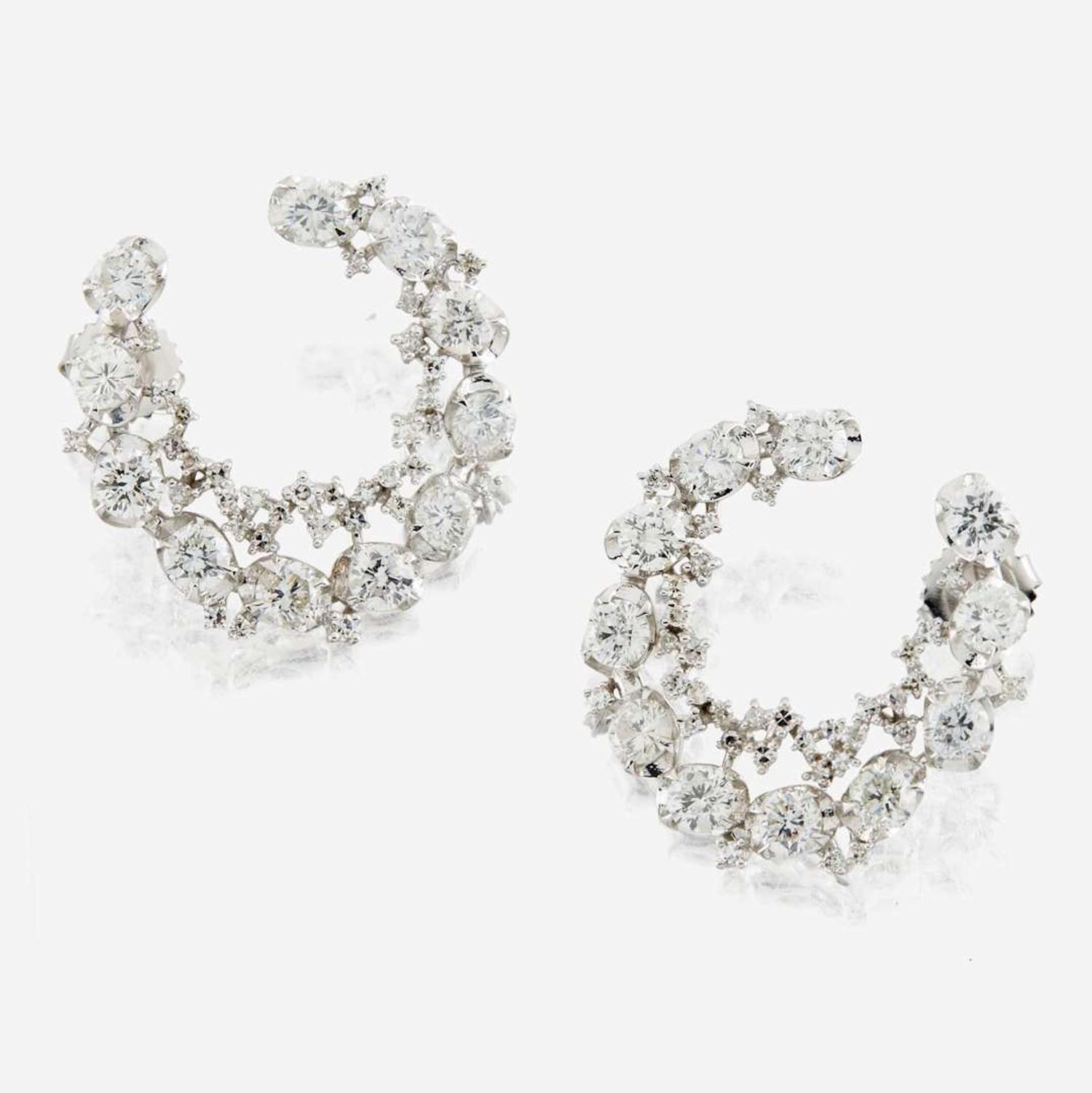 A pair of diamond and white gold earrings