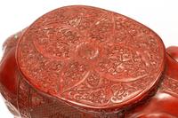 A Pair of Chinese Carved Red Lacquer Elephant Seats