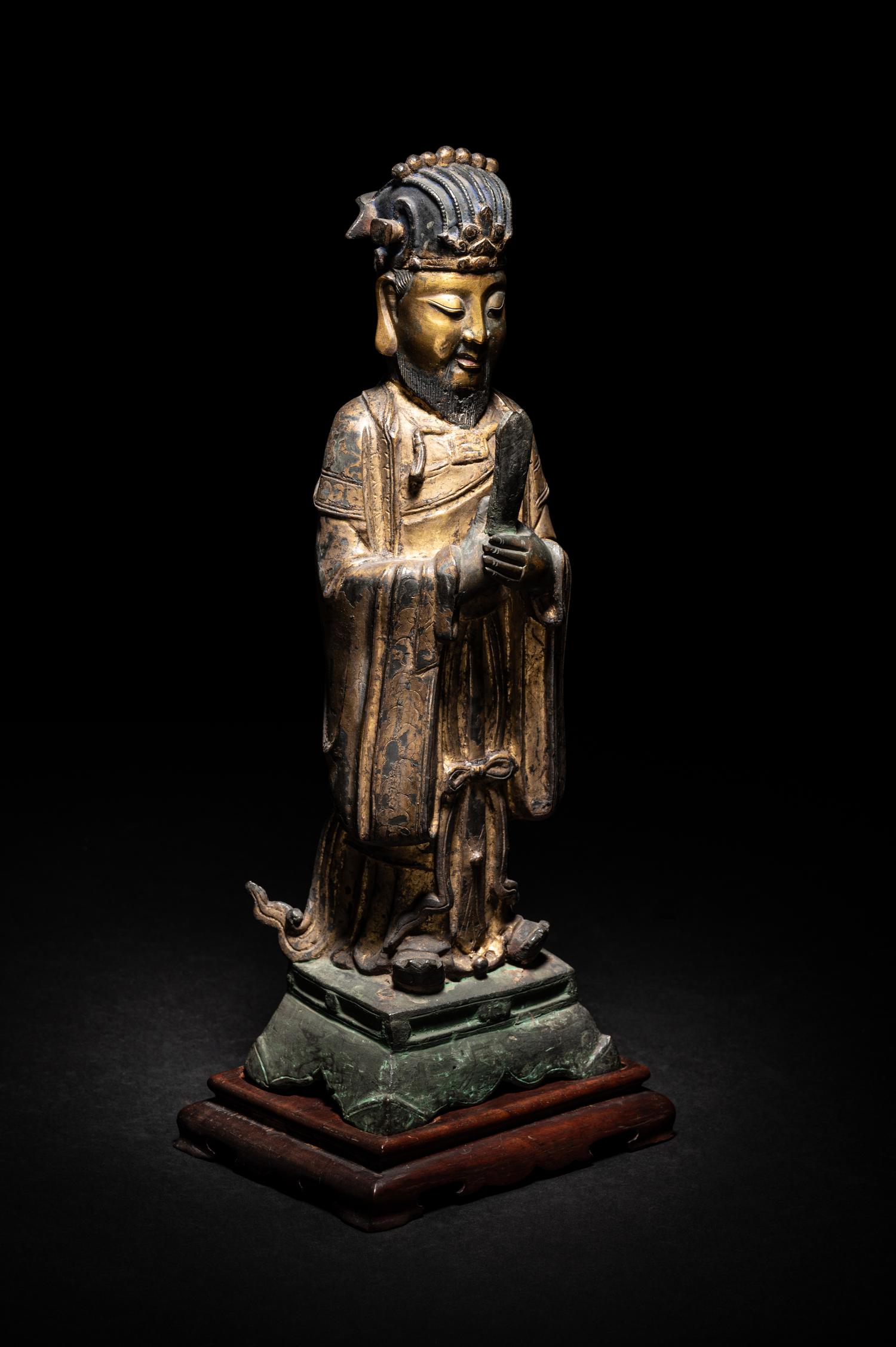 A Pair of Chinese Gilt Decorated Bronze Figures of Standing Officials